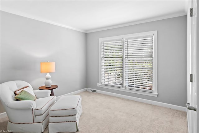 living area featuring ornamental molding, carpet floors, and baseboards