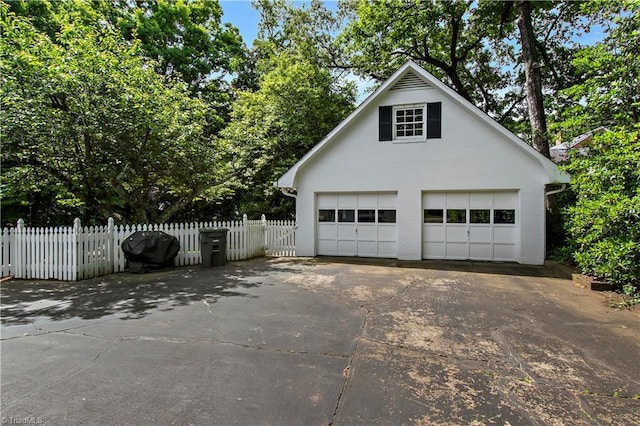 detached garage with fence