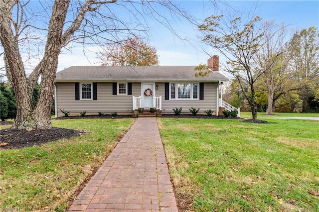 single story home featuring a front yard