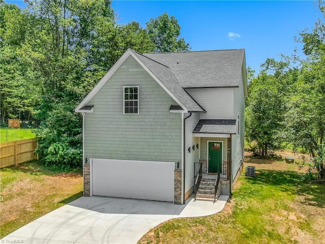 411 Motif Ln, Winston-Salem, NC 27107 - view of front of house with a shingled roof, driveway, and a garage