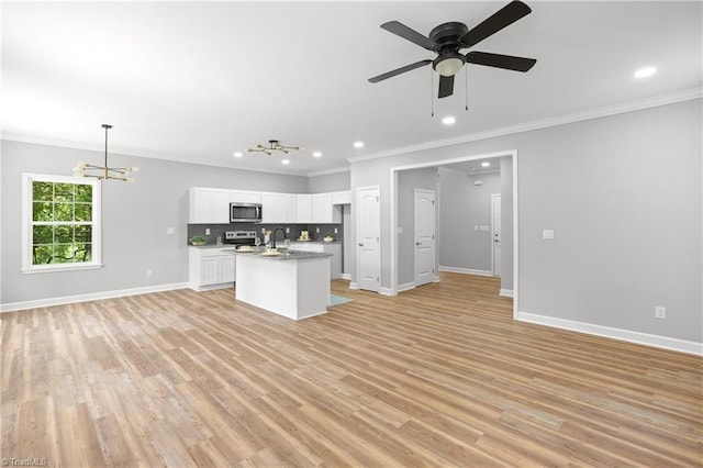 411 Motif Ln, Winston-Salem, NC 27107 - kitchen with stainless steel appliances, open floor plan, crown molding, a chandelier, and recessed lighting