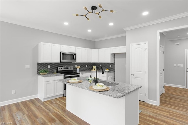 411 Motif Ln, Winston-Salem, NC 27107 - kitchen with appliances with stainless steel finishes, tasteful backsplash, white cabinets, ornamental molding, and recessed lighting