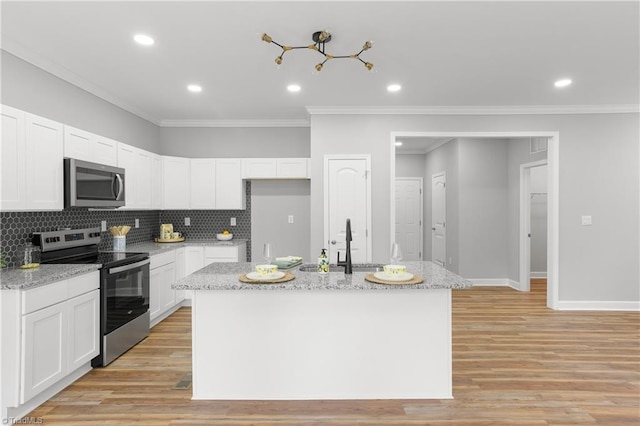 411 Motif Ln, Winston-Salem, NC 27107 - kitchen with appliances with stainless steel finishes, crown molding, white cabinetry, light stone countertops, and recessed lighting