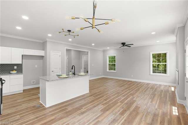 411 Motif Ln, Winston-Salem, NC 27107 - kitchen with recessed lighting, a chandelier, white cabinetry, a ceiling fan, and plenty of natural light