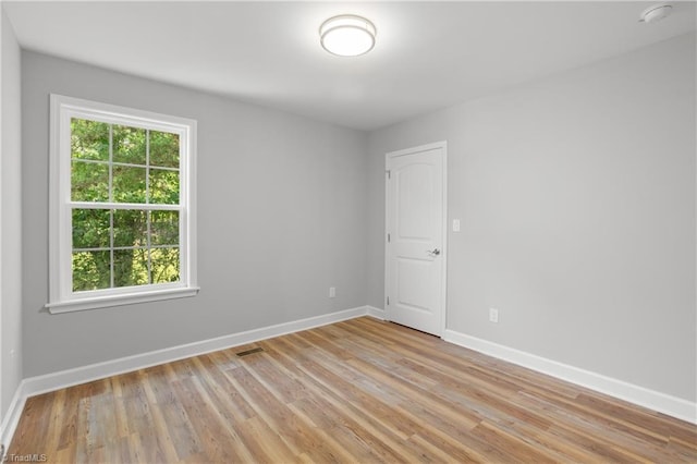 411 Motif Ln, Winston-Salem, NC 27107 - empty room with light wood finished floors and a smoke detector