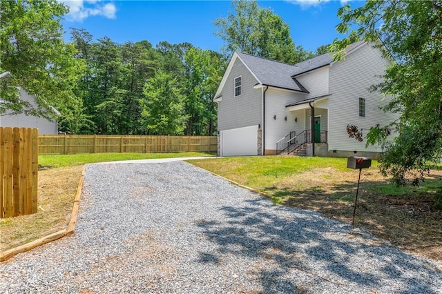 411 Motif Ln, Winston-Salem, NC 27107 - view of side of property featuring an attached garage, crawl space, and gravel driveway