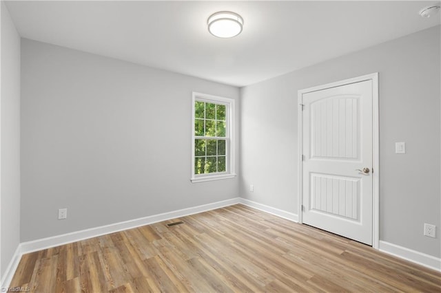 411 Motif Ln, Winston-Salem, NC 27107 - empty room with light wood-type flooring and a smoke detector