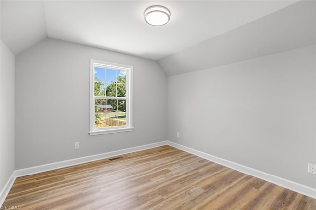 411 Motif Ln, Winston-Salem, NC 27107 - additional living space with lofted ceiling and light wood-style floors