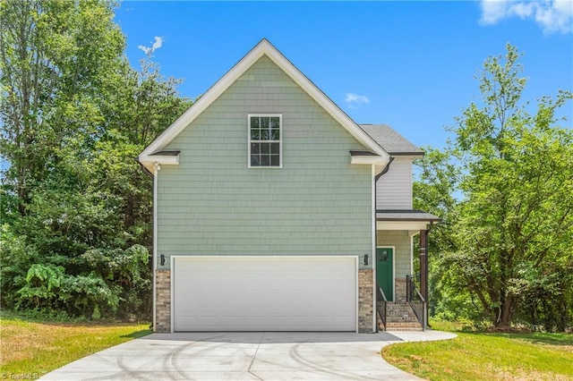 411 Motif Ln, Winston-Salem, NC 27107 - traditional-style home featuring concrete driveway, a garage, and a front yard