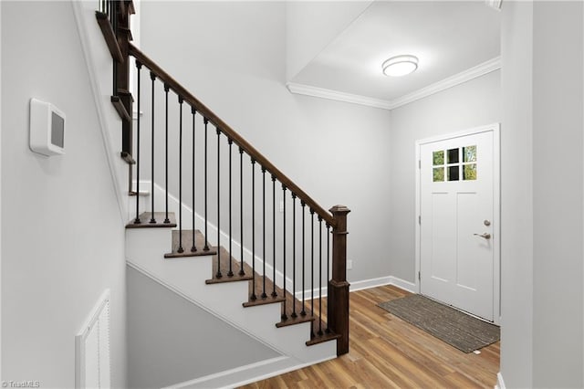 411 Motif Ln, Winston-Salem, NC 27107 - entryway with ornamental molding, wood finished floors, and stairs