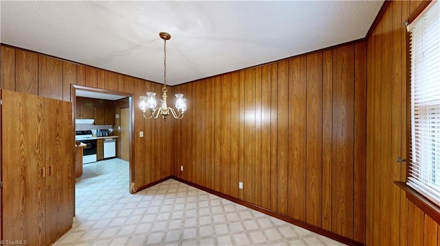 4211 Village Dr, Trinity, NC 27370 - unfurnished dining area featuring a chandelier, light flooring, and wooden walls