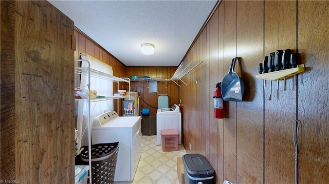 4211 Village Dr, Trinity, NC 27370 - clothes washing area with washer and clothes dryer, wood walls, gas water heater, light floors, and electric panel