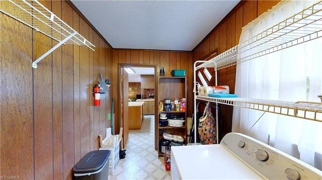 4211 Village Dr, Trinity, NC 27370 - laundry room with washer / dryer, wood walls, light floors, and a textured ceiling