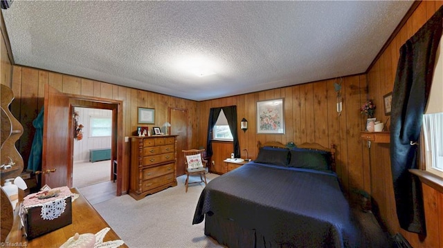 4211 Village Dr, Trinity, NC 27370 - bedroom featuring light carpet, multiple windows, a textured ceiling, and wood walls
