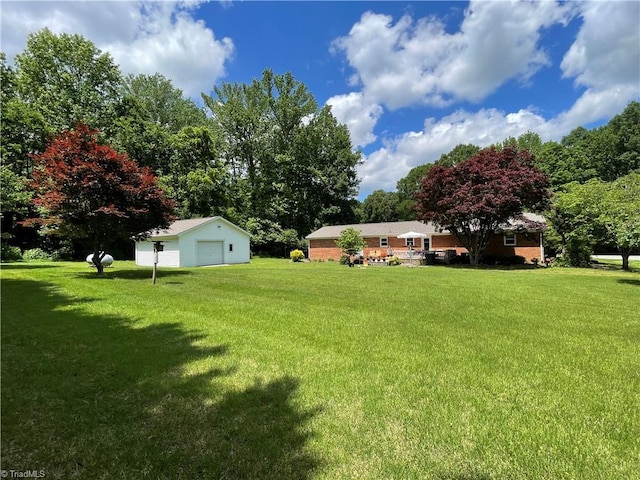 4211 Village Dr, Trinity, NC 27370 - view of grassy yard with a garage and an outbuilding