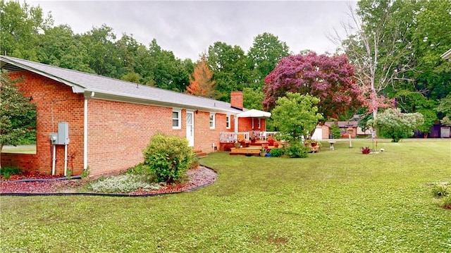 4211 Village Dr, Trinity, NC 27370 - view of green lawn with a deck