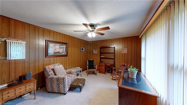 4211 Village Dr, Trinity, NC 27370 - living area featuring a ceiling fan, carpet flooring, healthy amount of natural light, a textured ceiling, and wooden walls