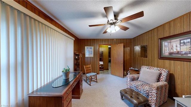 4211 Village Dr, Trinity, NC 27370 - sitting room featuring a ceiling fan, wood walls, and carpet flooring
