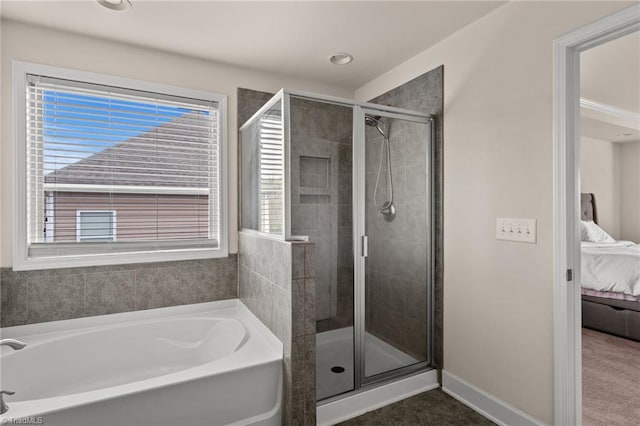 bathroom with tile patterned flooring and shower with separate bathtub