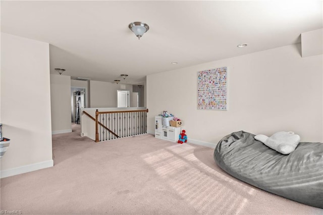 living area featuring light colored carpet