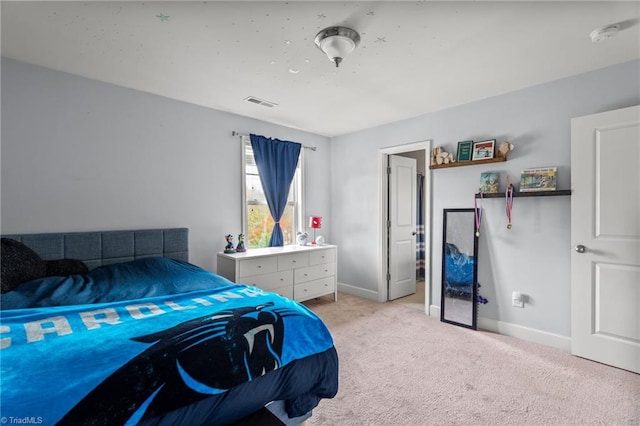 bedroom featuring light colored carpet