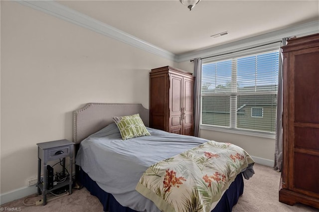 carpeted bedroom featuring crown molding