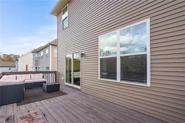 wooden deck with an outdoor living space