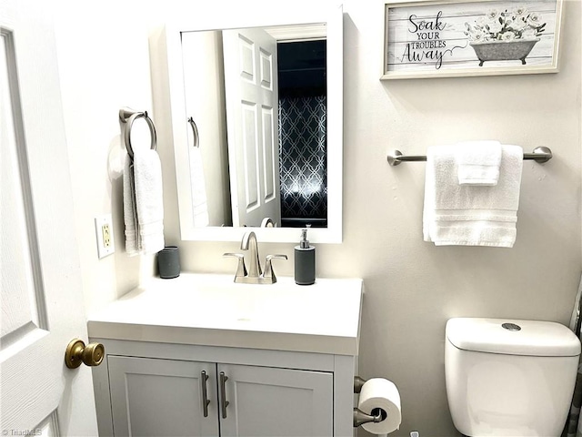 half bath with toilet and vanity