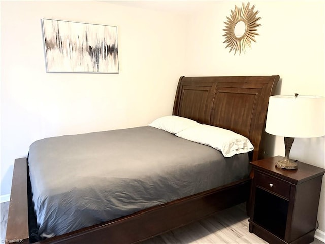 bedroom featuring light wood-style flooring