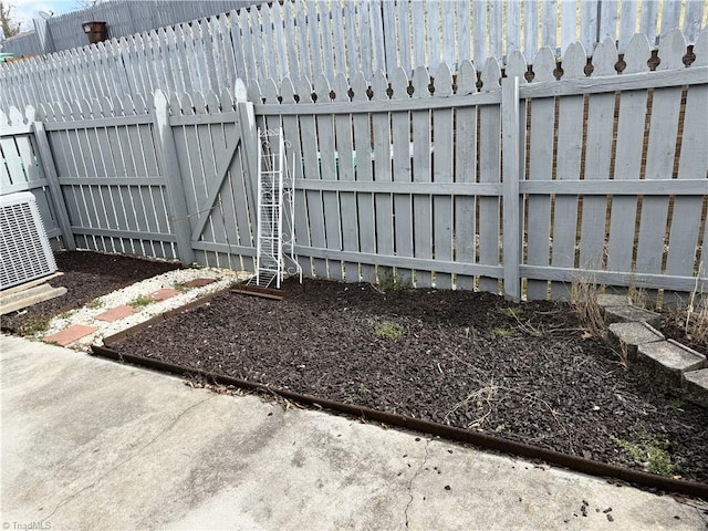 view of gate with a fenced backyard