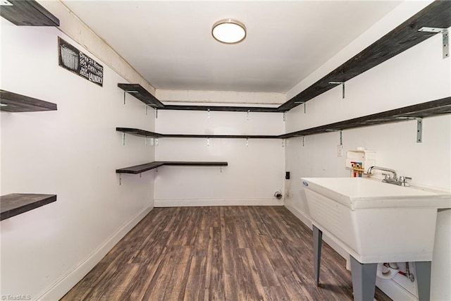 laundry area with sink, dark hardwood / wood-style flooring, and hookup for a washing machine