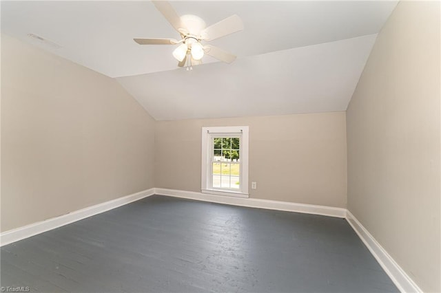 additional living space featuring ceiling fan, dark wood-type flooring, and lofted ceiling