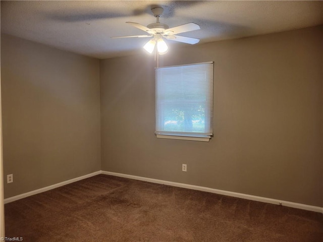 4001 S Bend Dr Unit 101, Winston-Salem, NC 27107 - empty room featuring dark carpet, ceiling fan, and baseboards