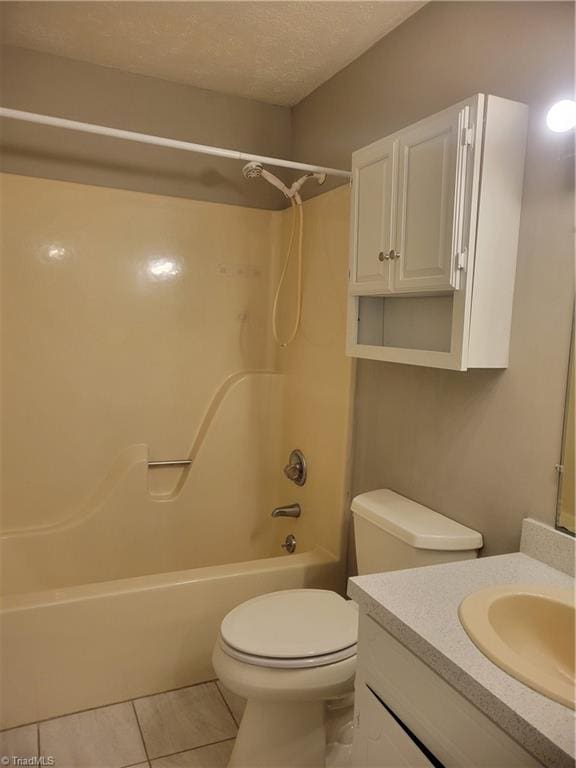 4001 S Bend Dr Unit 101, Winston-Salem, NC 27107 - full bathroom featuring vanity, tile patterned floors,  shower combination, toilet, and a textured ceiling