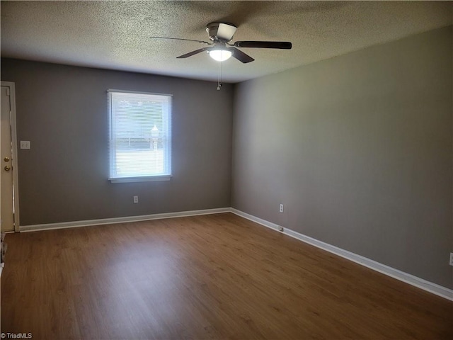 4001 S Bend Dr Unit 101, Winston-Salem, NC 27107 - unfurnished room featuring a ceiling fan, wood finished floors, a textured ceiling, and baseboards