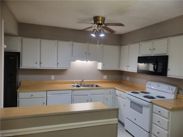 4001 S Bend Dr Unit 101, Winston-Salem, NC 27107 - kitchen with white appliances, a sink, a ceiling fan, light countertops, and a textured ceiling