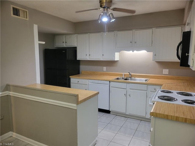 4001 S Bend Dr Unit 101, Winston-Salem, NC 27107 - kitchen with black appliances, a sink, a ceiling fan, wooden counters, and light tile patterned floors
