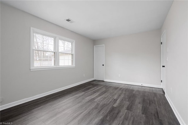 empty room featuring dark hardwood / wood-style floors