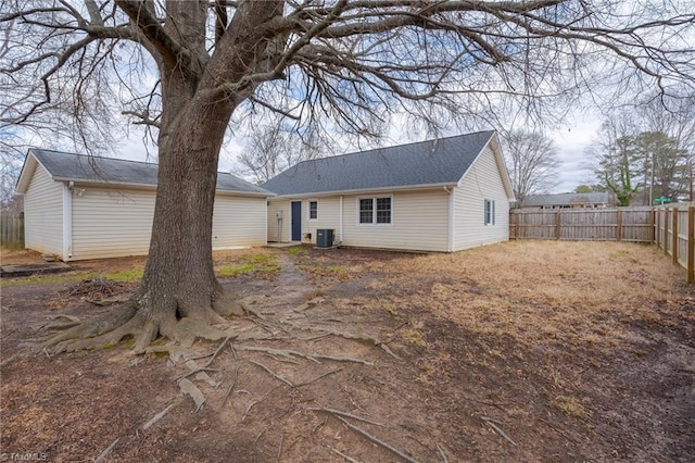 back of house featuring central AC unit