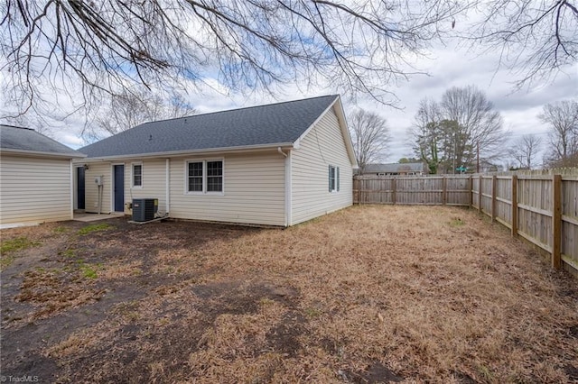 back of house featuring central AC