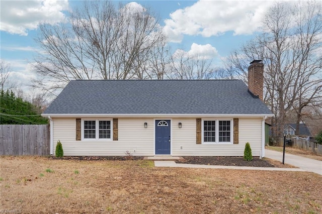 ranch-style house with a front lawn