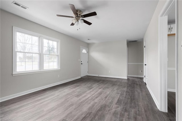 interior space featuring ceiling fan and dark hardwood / wood-style flooring