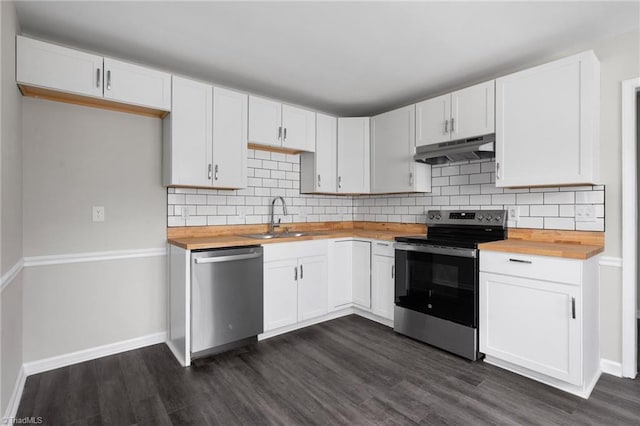 kitchen with sink, dark wood-type flooring, butcher block counters, stainless steel appliances, and white cabinets