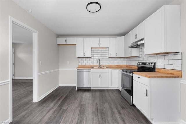 kitchen with butcher block counters, sink, white cabinetry, appliances with stainless steel finishes, and dark hardwood / wood-style floors