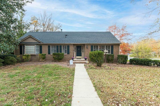 ranch-style home with a front yard