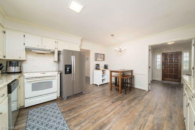 kitchen featuring dark wood-type flooring, light stone countertops, white cabinetry, and stainless steel appliances