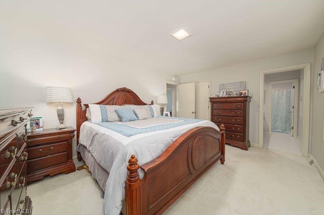 bedroom featuring light carpet