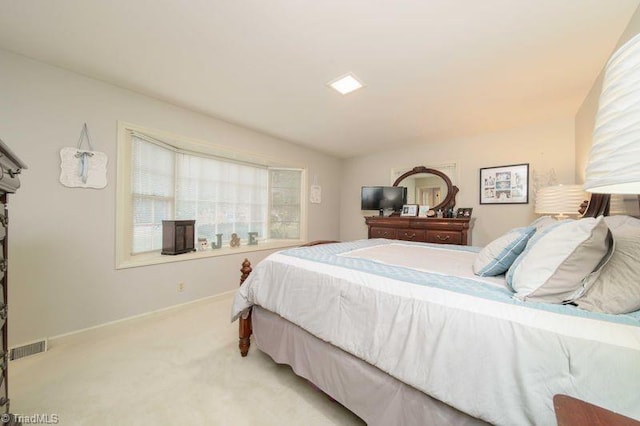 bedroom with light carpet and vaulted ceiling