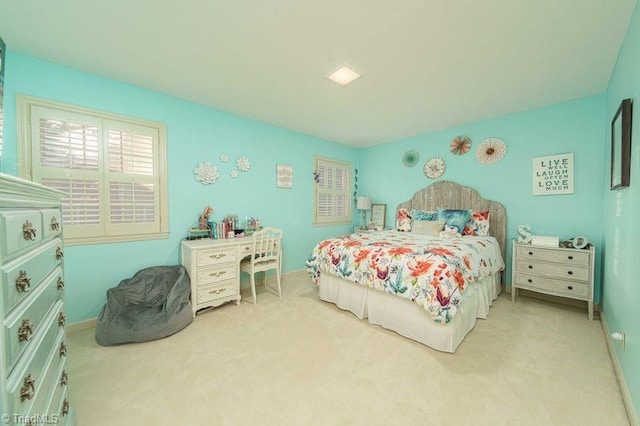 bedroom with light colored carpet