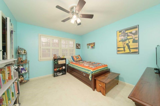 bedroom featuring ceiling fan and light colored carpet